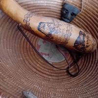 Antica corbula con zucca e maschera