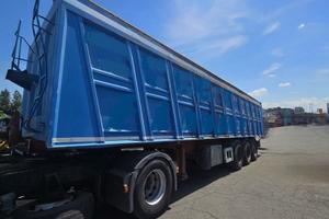 Semirimorchio ribaltabile posteriore per rottami