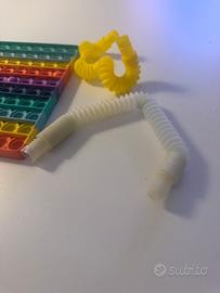Giochi sensoriali Pop it + 2 tubi estensibili