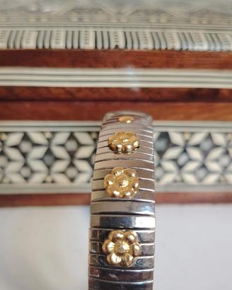 Bracciale elastico in acciaio e inserti oro 18 Kt