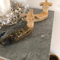 Coppia di sirene in argilla smaltata