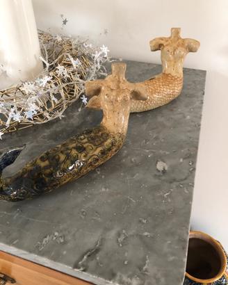Coppia di sirene in argilla smaltata