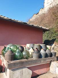 Damigiane in vetro .