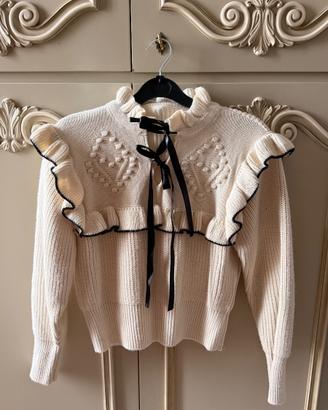 Maglione con bordi neri e volant