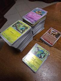 Lotto di carte Pokémon vari set comuni/reverse 122