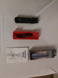 Rasoio regolabarba e capelli con pile da viaggio.