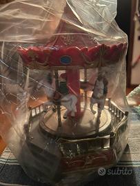 Giostra natalizia con luci, canzoni e movimento