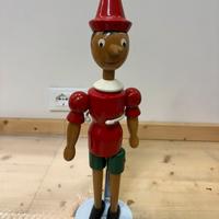 Pinocchio in legno con piedistallo vintage