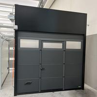 Portone sezionale RAL 7016 con porta 2500 x H 2000