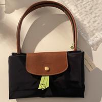 Borsa Longchamp nera con manico in pelle marrone