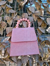 Borsa rosa effetto pitonato manico a perle Pimkie