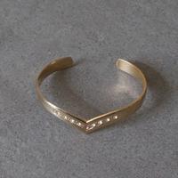 Braccialetto rigido dorato con strass 