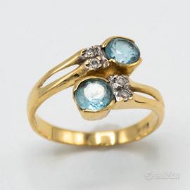 Anello donna in oro giallo 18 kt con topazi D.80