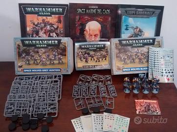 Miniature Warhammer 40.000 con manuali e colori