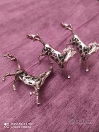 Tre cavalli in argento