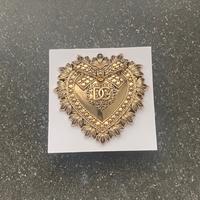 spilla devotion dolce e gabbana nuova dorata