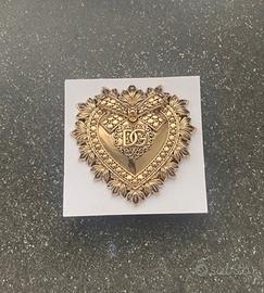 spilla devotion dolce e gabbana nuova dorata