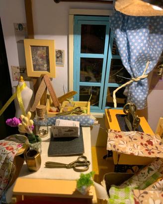 sartoria in miniatura e fruttivendolo in miniatura