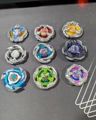 Lotto Beyblade X - 9 Modelli Top (UX/BX) + Lanciat