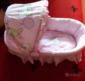 Culla in vimini e rivestimento lavabile