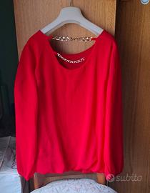 Blusa a maniche lunghe con catene sul retro 