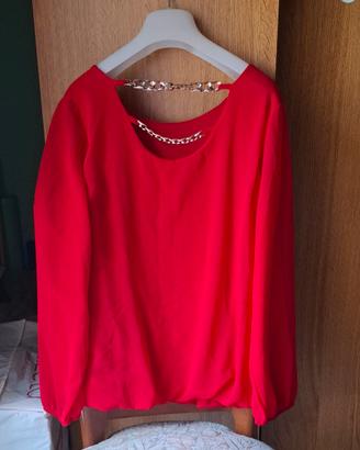Blusa a maniche lunghe con catene sul retro 