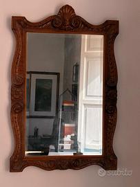 specchio molato con grande cornice intagliata