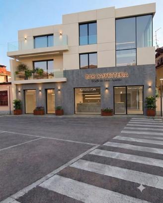 Locale Commerciale con Appartamenti