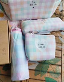 Porta trucco+ombrello+kit da viaggio.