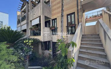 APPARTAMENTO CON GIARDINO PRIVATO E POSTO AUTO