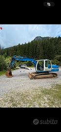 Liebherr R 317 triplice con lama