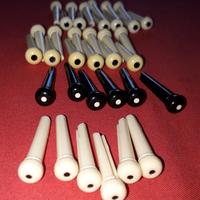 Perni ponte (pins) per chitarra acustica.