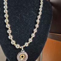 Collana con ciondolo in acciaio con centrale “sole