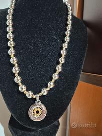 Collana con ciondolo in acciaio con centrale “sole