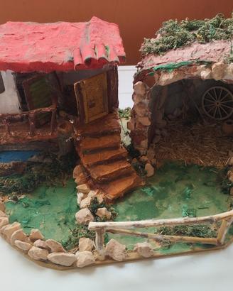 grotta con casetta, dotato di lucine 