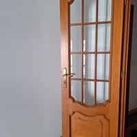 Porte in legno con inserti in vetro e non