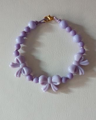 Braccialetto con perline e fiocchetti 