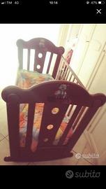 CULLA IN LEGNO E A DONDOLO