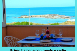 Bilocale sulla spiaggia di sabbia con box auto