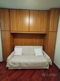 Mobile a ponte con divano letto