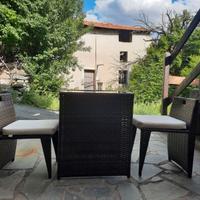 Tavolino da esterno con ripiano in vetro e 2 sedie