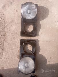Fari ante sx/dx carello con supporti fiat 131/132