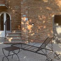 Lettino Prendisole in ferro battuto con ruote