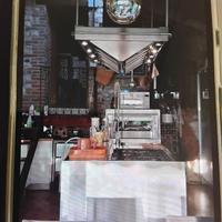 Cucina Arclinea in acciaio con isola centrale