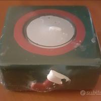 Portacandela con candela in ceramica. Sigillata.