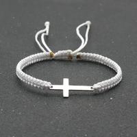 Bracciale bianco regolabile con croce in acciaio