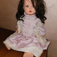 Bambola antica con capelli veri