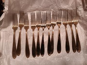 Antiche forchette color oro 