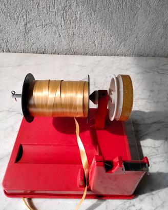 accessorio per confezionare pacchetti 