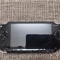 PSP per pezzi ricambio + alimentatore + giochi